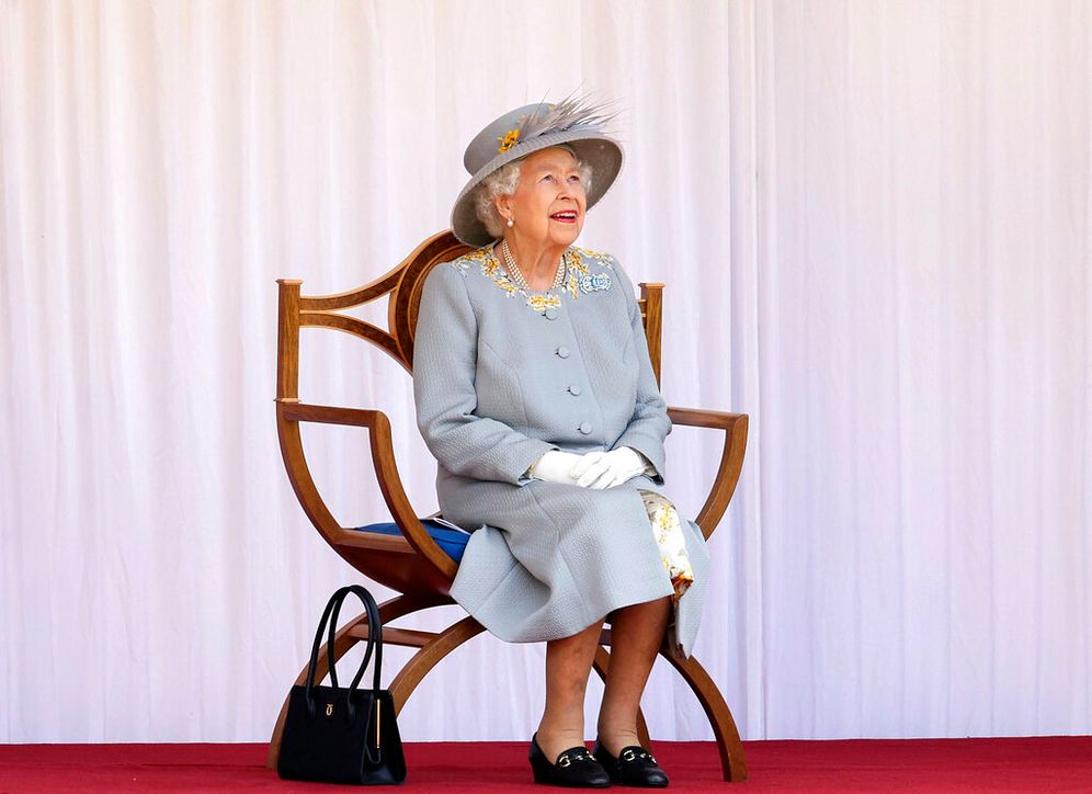 Britain's late Queen Elizabeth II watches red arrows fly over to mark her official birthday at Windsor Castle, Windsor, England, on June 12, 2021.