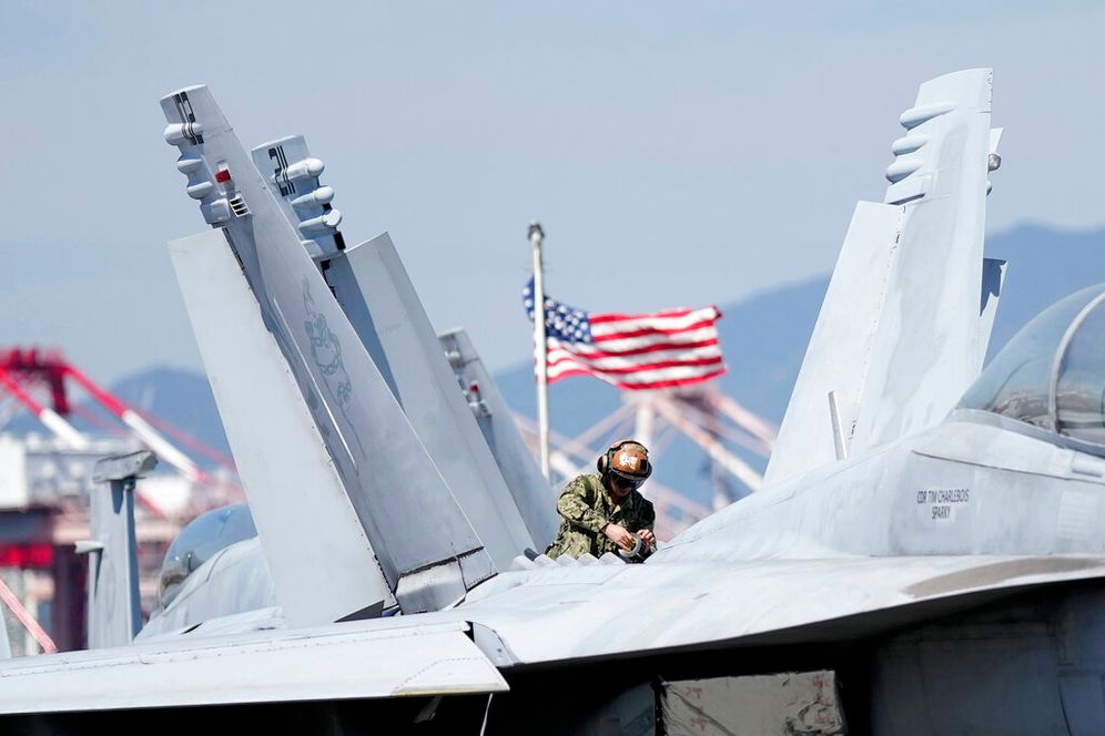 AP Photo/Lee Jin-man, File Photo A US soldier checks the F/A-18 Super Hornet fighter jet on the deck of the nuclear-powered aircraft carrier USS Ronald Reagan in Busan, South Korea, on September 23, 2022.