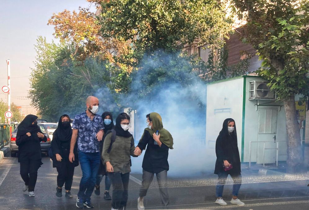 Archive - Tear gas is fired by security forces to disperse protestors in front of Tehran University in Tehran, Iran, on October 1, 2022.