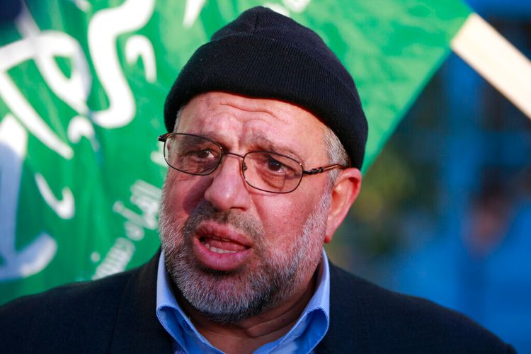 FILE - In this Sunday, Jan. 19, 2014 file photo, Hassan Yousef, leader of the Hamas Islamist movement in the West Bank, speaks to the media after he was released from Israeli prison, in the West Bank city of Ramallah