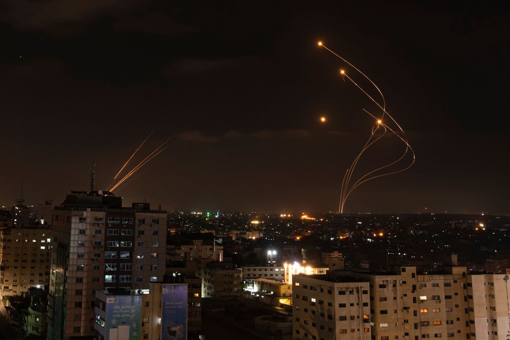 Rockets fired from Gaza and intercepted by Israel's Iron Dome anti-missile system over Israeli skies.