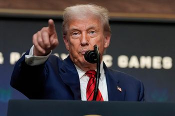 President Donald Trump answers questions from reporters after signing an executive order about the 2028 Los Angeles Olympic Games