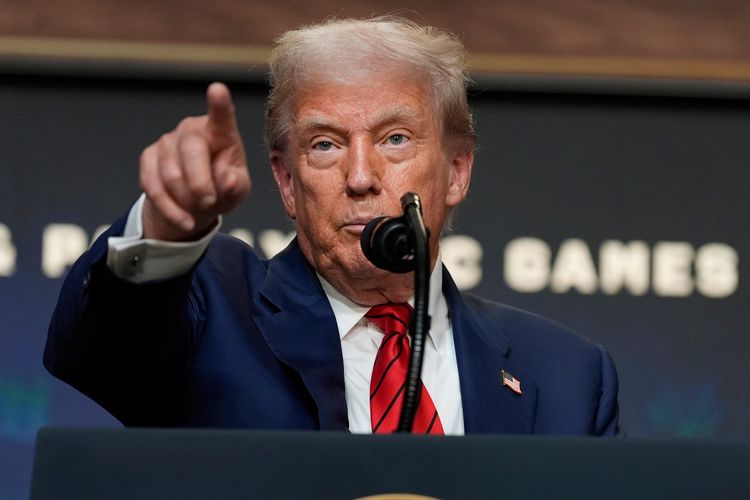 President Donald Trump answers questions from reporters after signing an executive order about the 2028 Los Angeles Olympic Games