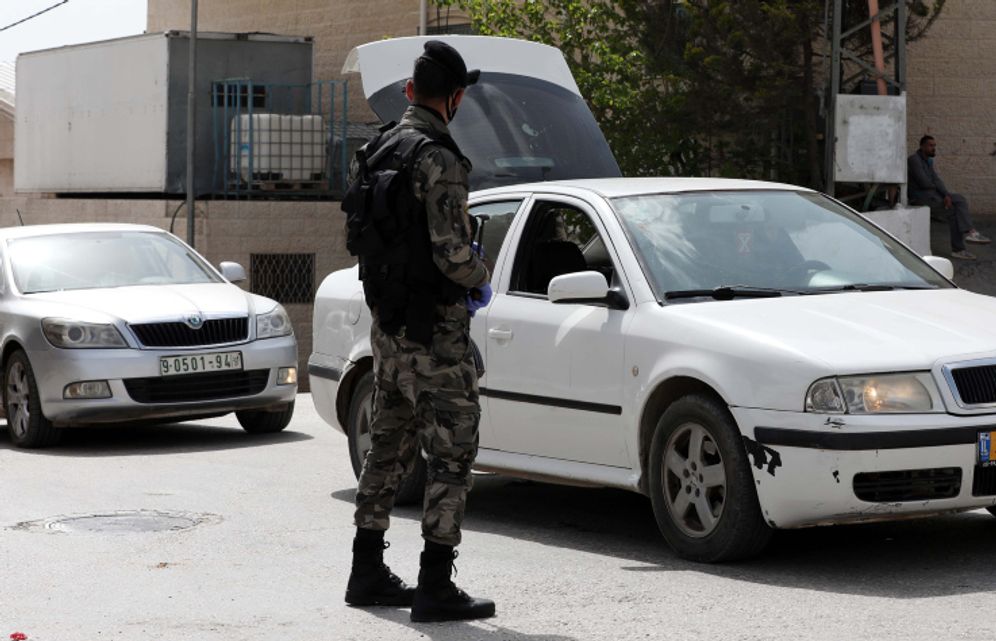 Palestinian security forces at the West Bank city of Hebron on April 19, 2020.