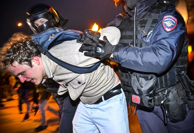 Police officers detain a man following calls to protest against partial mobilization announced by Russian President Vladimir Putin, in Moscow, Russia on September 21, 2022.
