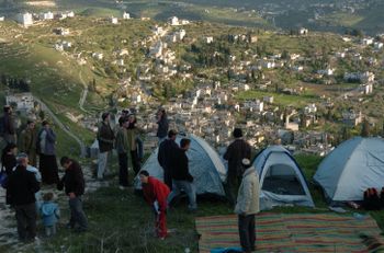 Right-wing Jewish settlers build tents as they gather in the former Jewish West Bank settlement of Homesh.