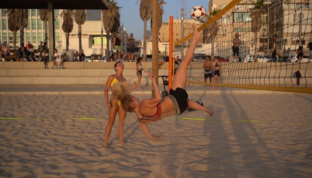 Israelis play footvolley on the beach in Tel Aviv, Israel.