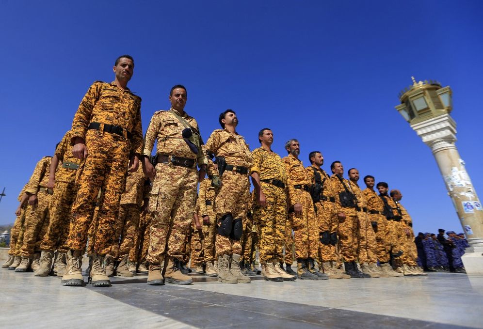 Fighters loyal to the Houthi rebels stand in formation outside al-Saleh grand mosque in Sanaa, Yemen, on October 12, 2022.