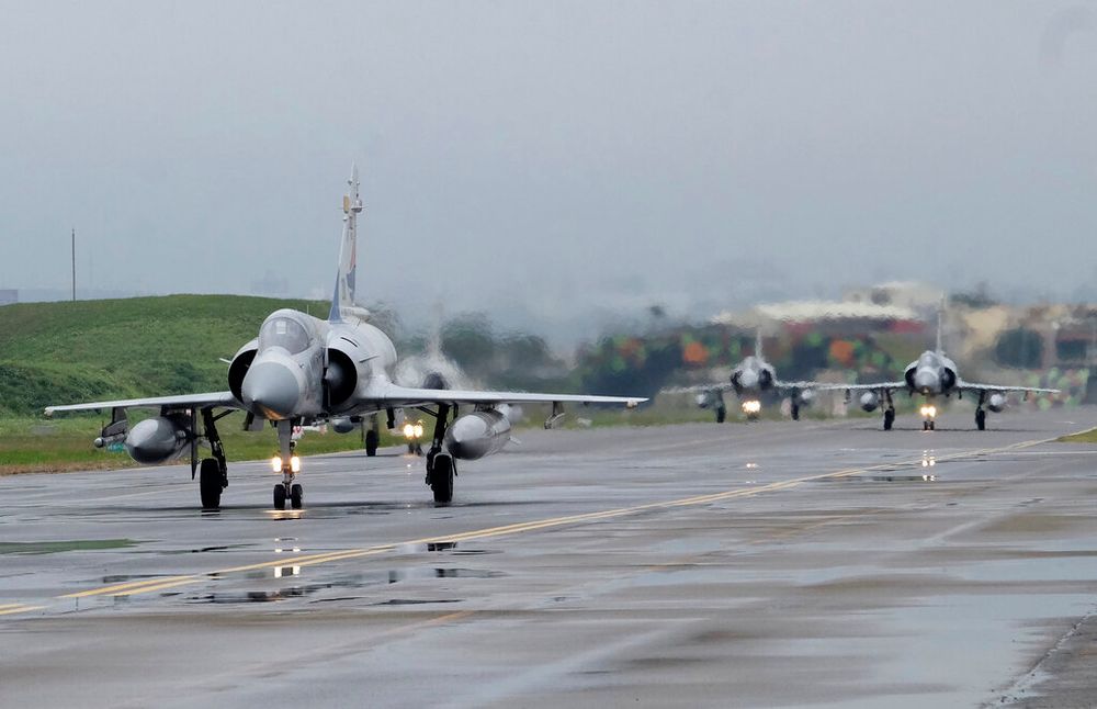 Taiwanese Mirage 2000 fighter jets taxi along a runway during a drill at an airbase in Hsinchu, Taiwan.