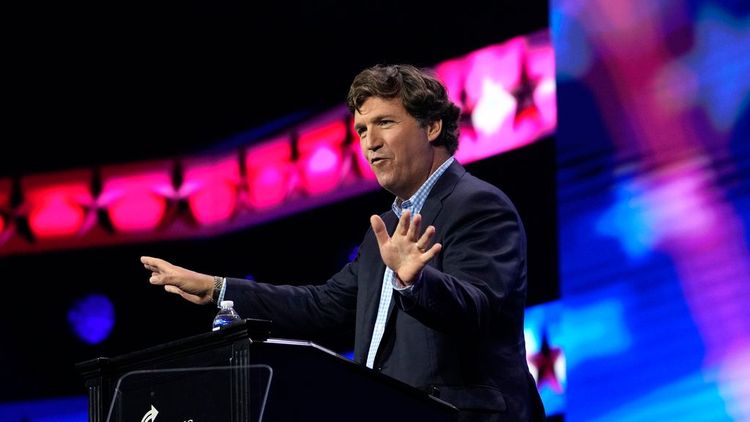 Tucker Carlson speaks at the Turning Point Action conference, July 15, 2023, in West Palm Beach, Fla.