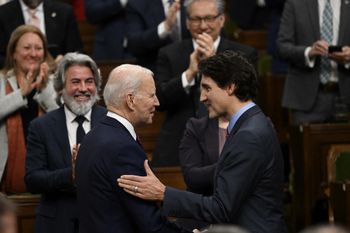 U.S. President Joe Biden shakes hands with Canadian Prime Minister Justin Trudeau at the Canadian Parliament in Ottawa, Ontario, Canada.