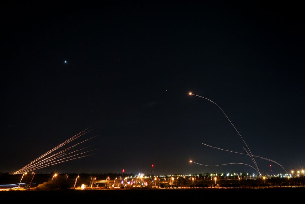 Iron dome aeries defense system fires interception missiles as rockets are fired from the Gaza Strip, in the southern city of Sderot, Israel.