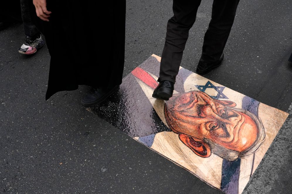 (AP Photo/Vahid Salemi) Iranian demonstrators walk on a caricature of the Israeli Prime Minister Benjamin Netanyahu during the annual anti-Israeli Quds Day, or Jerusalem Day rally in support of Palestinians, in Tehran, Iran, Friday, March 28, 2025.