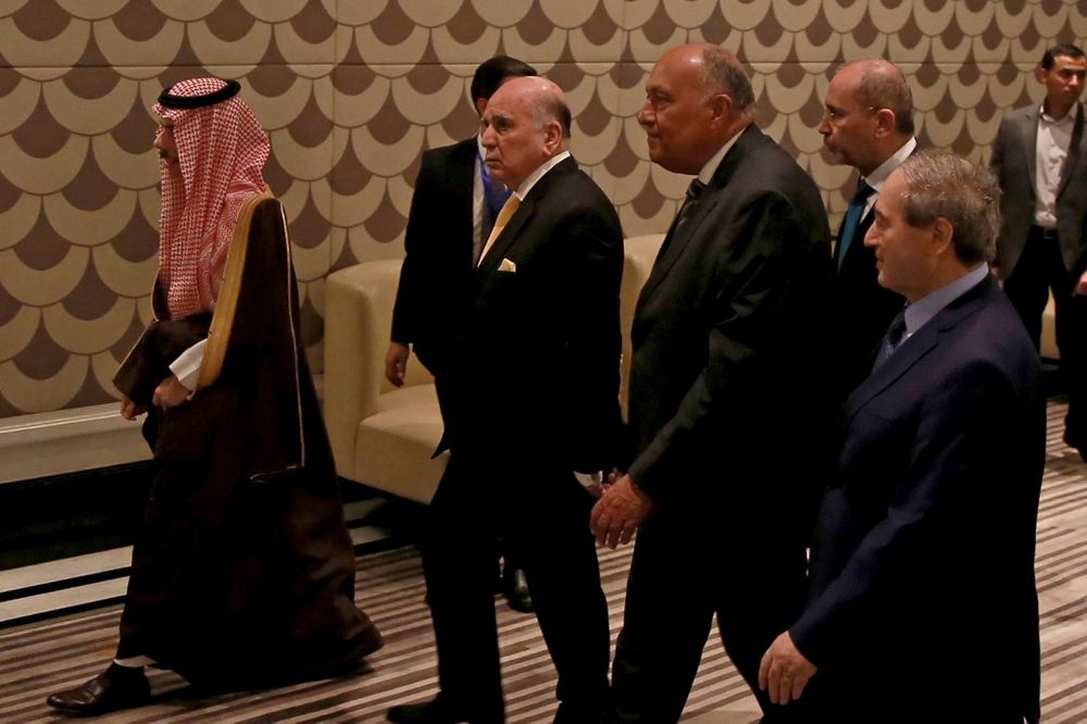 Saudi Arabia's Foreign Minister Faisal bin Farhan (L), Arab League Secretary-General Ahmed Aboul-Gheit, Egyptian Foreign Minister Sameh Shoukry, Syrian Foreign Minister Faisal Mekdad (R) arrive for a regional meeting on Syria, in Amman, Jordan