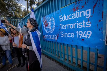 Activists protest against United Nations Relief and Works Agency for Palestine Refugees (UNRWA) outside their offices in Jerusalem, March 20, 2024.