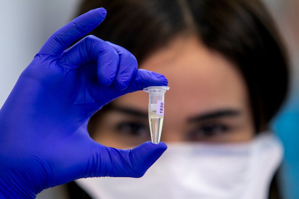 Yossi Aloni/Flash90 Technicians carry out a diagnostic test for coronavirus in a lab at the Rambam Hospital in Haifa, on March 17, 2020.