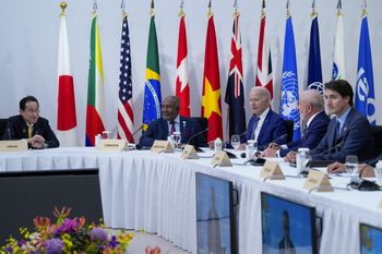 US President Joe Biden (3rd R) reacts at a working session during the G7 Leaders' Summit in Hiroshima