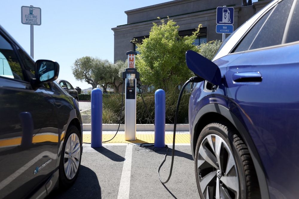 CORTE MADERA, CALIFORNIA - JULY 28: Nissan and Volkswagen electric cars sit parked at a Charge Point EV charging station on July 28, 2023 in Corte Madera, California.