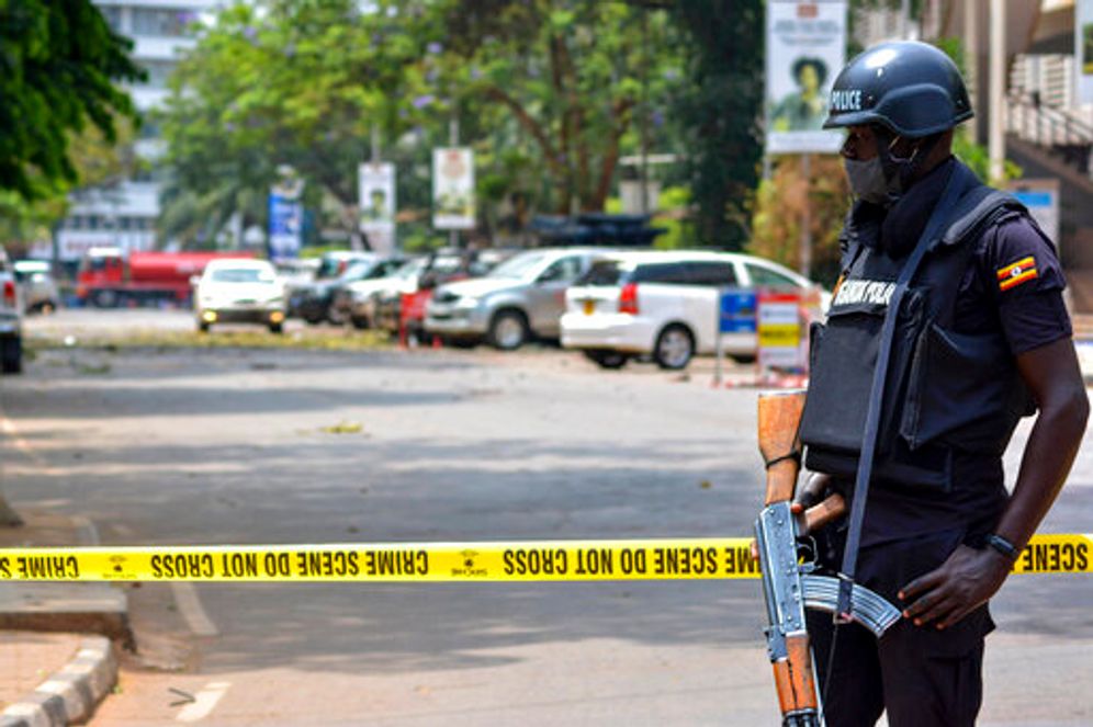 Security forces secure the scene of a blast on a street near the parliamentary building in Kampala, Uganda, November 16, 2021.