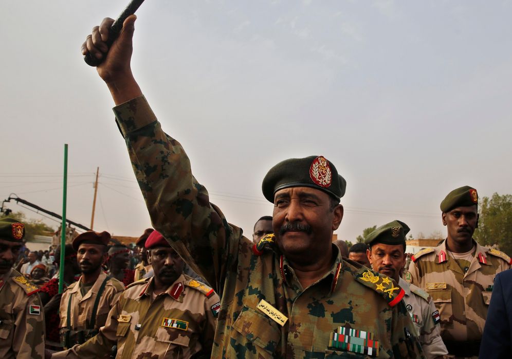 Sudanese Gen. Abdel-Fattah Burhan, head of the military council, waves to his supporters upon his arrival in Omdurman district, west of Khartoum, Sudan, on June 29, 2019.