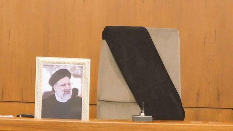 A black mourning sash draped over the seat normally occupied by Iranian President Ebrahim Raisi following his death.