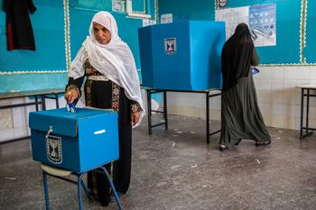 Bedouin women vote during general elections in the city of Rahat in the Negev desert, southern Israel.