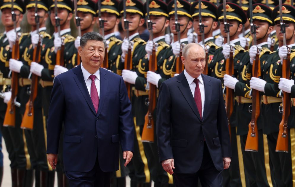 Maxim Shemetov/Pool Photo via AP Russian President Vladimir Putin, right, and Chinese President Xi Jinping inspect an honor guard during a welcoming ceremony at the Great Hall of the People in Beijing Wednesday, May 20, 2026.