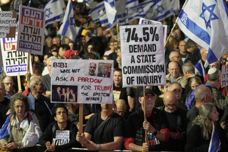 People gather at Habima square in Tel Aviv, on Nov. 15, 2025, to take part in a protest against Prime Minister Benjamin Netanyahu's government and call for a state commission of inquiry to investigate the events of Hamas attack of October 7