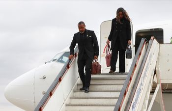 Malawi Vice President Saulos Chilima,left, and his wife Mary disembark from a plane upon his return from South Korea in Lillongwe, Sunday, June 9, 2024.