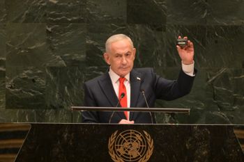 Israeli Prime Minister Benjamin Netanyahu holds up a pager during his address to the United Nations General Assembly, September 24, 2026.