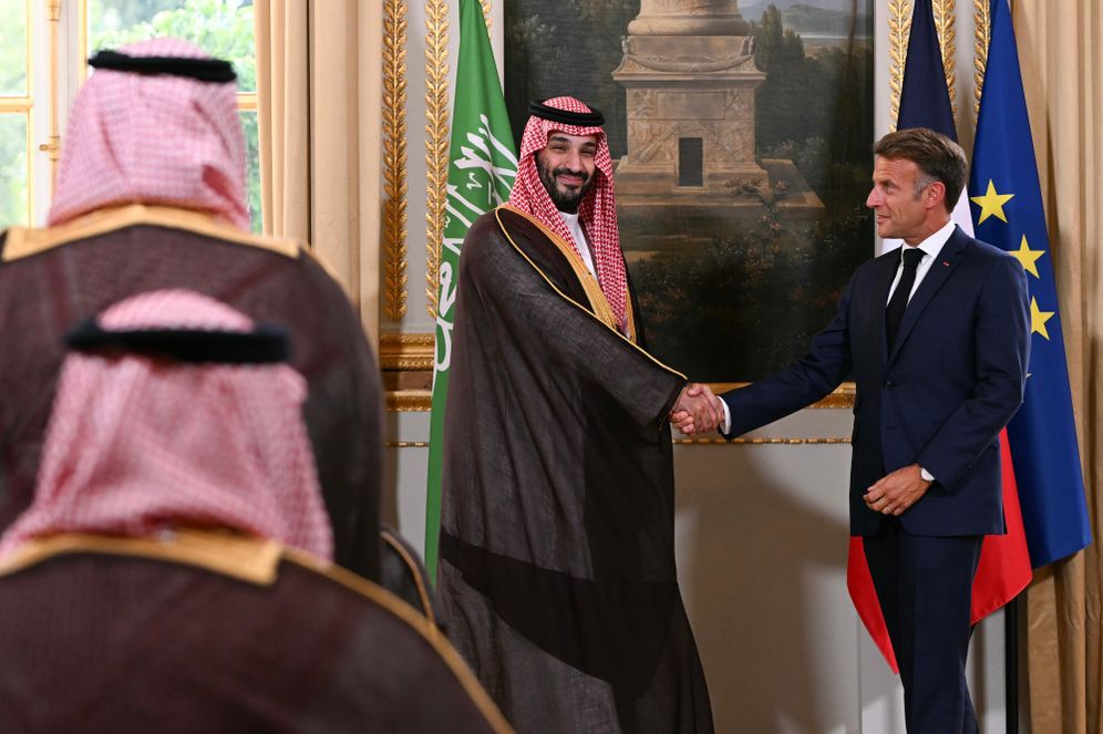 Lou Benoist/Pool Photo via AP France's President Emmanuel Macron, right, and Saudi Arabia's Crown Prince Mohammed bin Salman shake hands during a trade agreement signature ceremony after their meeting at the Elysee Palace in Paris, Monday Aug. 24, 2026. (Lou Benoist/Pool Photo via AP)