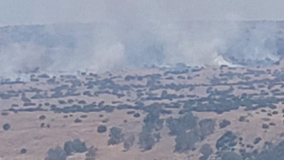 Fires break out after rockets launched from Lebanon land in open areas, near Kibbutz Amir in northern Israel.
