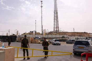 Israeli soldiers at the gate of the Mount Harif military base near the Egyptian border.