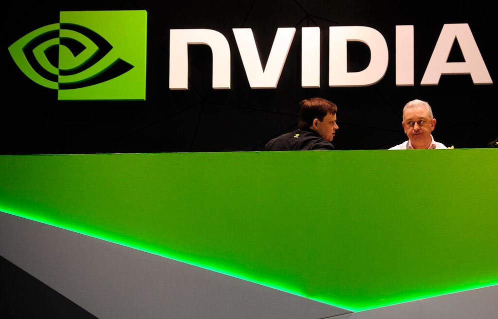 People gather in the Nvidia booth at the Mobile World Congress mobile phone trade show in Barcelona, Spain.