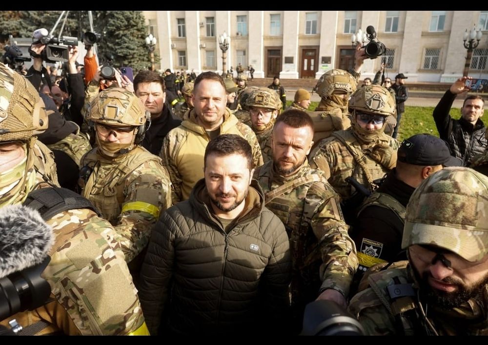 Ukrainian President Volodymyr Zelensky, accompanied by a security detail, visits the newly liberated southern city of Kherson.