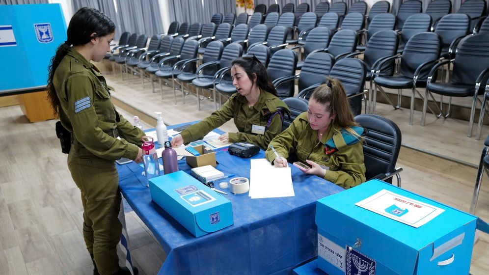 Photo by Michael Giladi/Flash90 IDF soldiers cast their votes in a ballot box of the Golan Brigade 474 for Israel's general election at the Sa'ar military base in central Golan Heights on November 1, 2022.