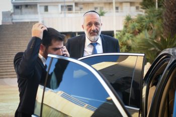 Shas chairman Aryeh Deri seen leaving a meeting with Benjamin Netanyahu during coalition talks at a hotel in Jerusalem.