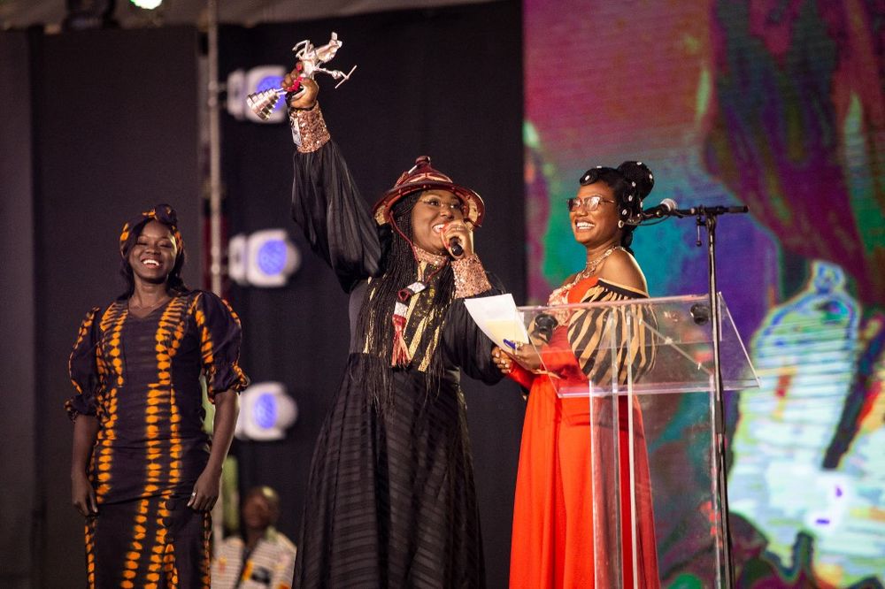 Burkinabe director Apolline Traore (C)after winning the Etalon d'Argent for her film 'Sira' during the 28th Pan-African Film and Television Festival in Ouagadougou, Burkina Faso.