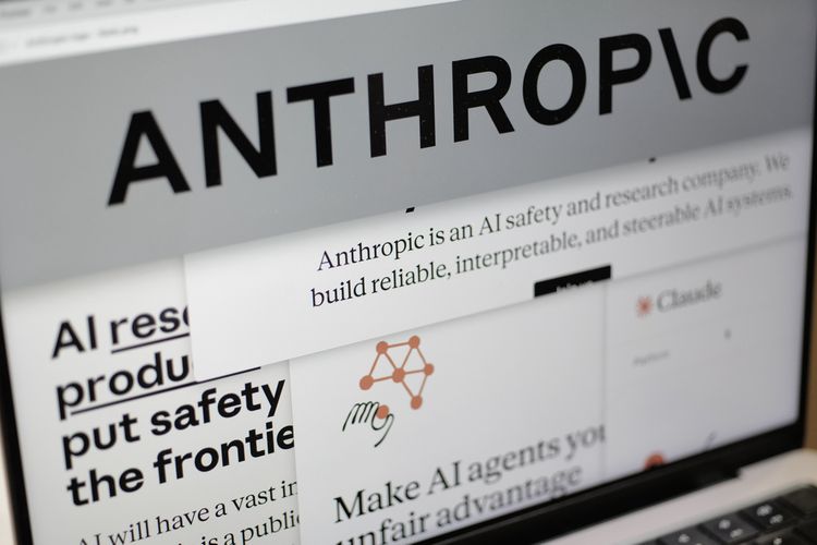 Pages from the Anthropic website and the company's logo are displayed on a computer screen in New York, Feb. 26, 2026