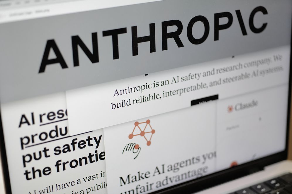 Pages from the Anthropic website and the company's logo are displayed on a computer screen in New York, Feb. 26, 2026