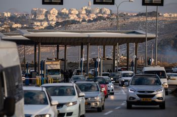 Palestinian vehicles pass through the Israeli army's az-Za'ayyem checkpoint near Ma’ale Adumim, in the West Bank, November 25, 2020.