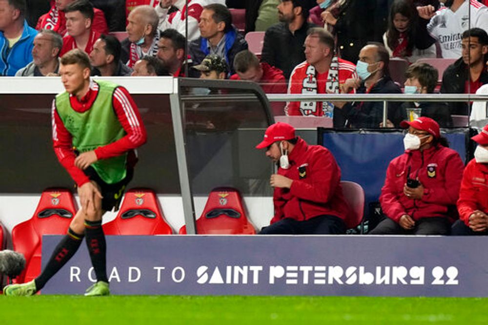 A soccer player warms up next to a UEFA board with the sentence "Road to Saint Petersburg 22" referring to the Champions League final former scheduled host city, in Lisbon, Portugal, on February 23, 2022.