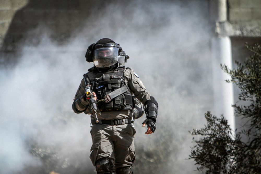 An Israeli officer at a protest in the village of Beita, the West Bank, on February 18, 2022.