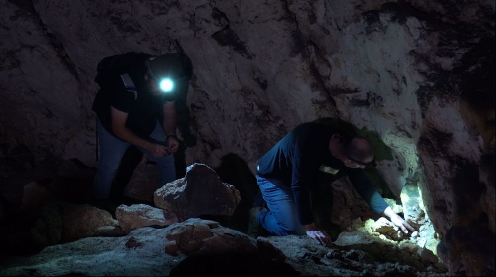 Researchers inside the Ein Jaleb cave in the West Bank.