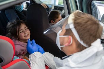 Magen David worker take a Covid-19 rapid antigen test from Israelis, at a Magen David Adom drive-through complex in Jerusalem, on January 17, 2022.