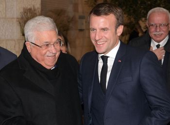 Palestinian Authority president Mahmoud Abbas (L) welcoming French President Emmanuel Macron at his headquarters in Ramallah in the West Bank, on January 22, 2020.