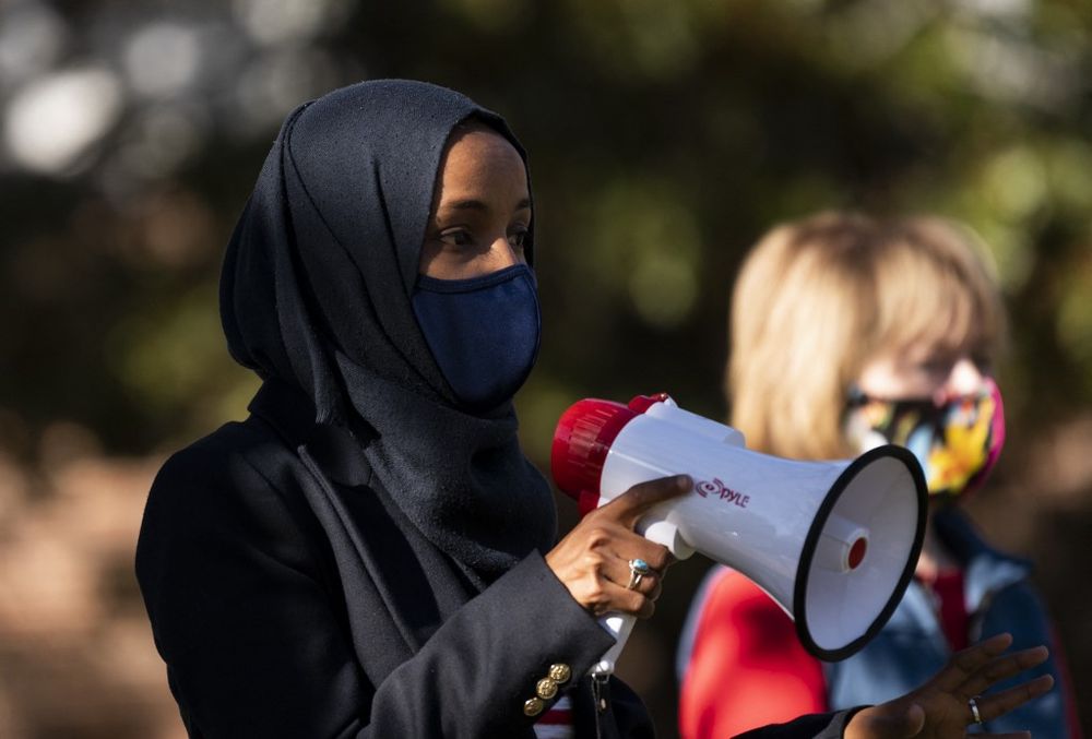 Rep. Ilhan Omar (D-MN) (left), attends a get out the vote event on the University of Minnesota campus in Minneapolis, Minnesota