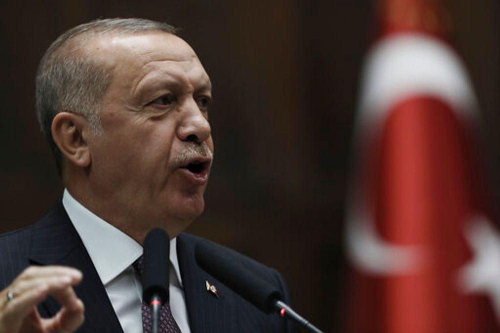 Turkish President Recep Tayyip Erdogan addresses his ruling Justice and Development Party legislators at the Parliament, in Ankara, Tuesday, Nov. 19, 2019.