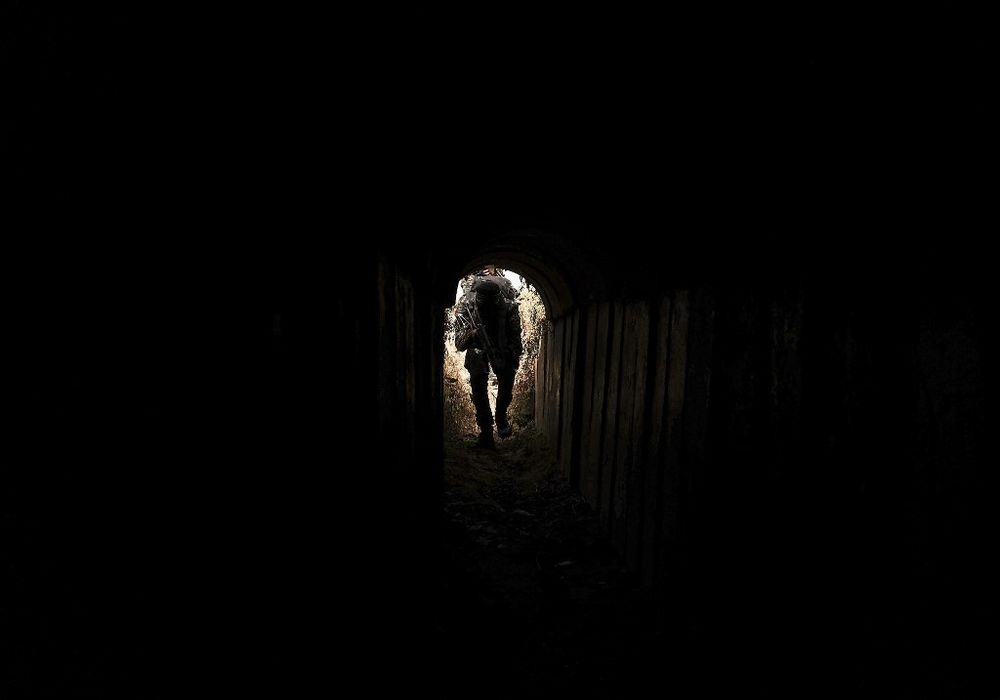 A member of the Palestinian Islamic Jihad enters a tunnel in Gaza, on April 17, 2022.