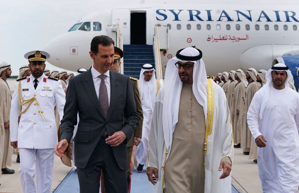 Syrian President Bashar Assad speaks with UAE President Sheikh Mohammed bin Zayed Al-Nahyan, in in Abu Dhabi, United Arab Emirates.